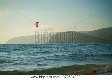 Kitesurfer Riding On The Waves At Prasonisi Kite Beach At Rhodes Island In Summer Day
