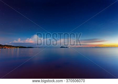 Sunset Time With Lightning And Can See The Stars In The Sky At Wok Tum Beach Phangan Island,thailand