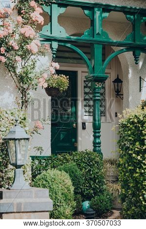 London, Uk - June 06, 2020: Facade Of An Edwardian House In London, Framed By Plants, Selective Focu