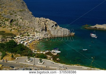 Rhodes, Greece - July 2019: Agios Pavlos Beach. Overlooking The Stunning St Pauls Bay Lindos