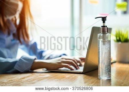 Bussiness Worman Work From Home Wearing Protection Mark In Covid-19 Virus Situation. Her Working In 