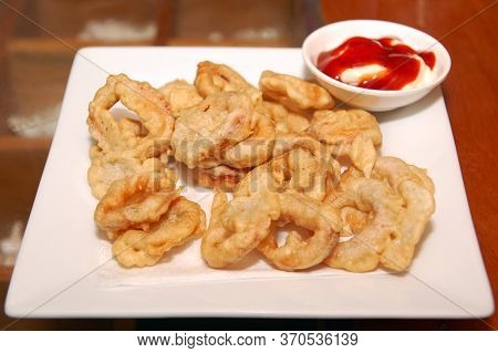 Fried Calamares Squid Rings With Ketchup And Mayonnaise Dip Meal On Plate