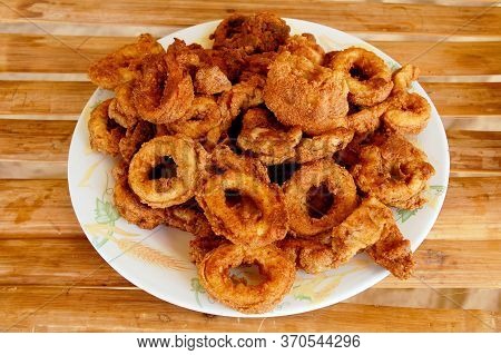 Fried Brown Crispy Calamares Squid Seafood Meal Served On Plate