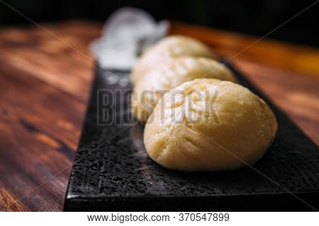 Closeup On Korean Steamed Pjan-se Pigodi Pies With Cabbage And Meat , Horizontal