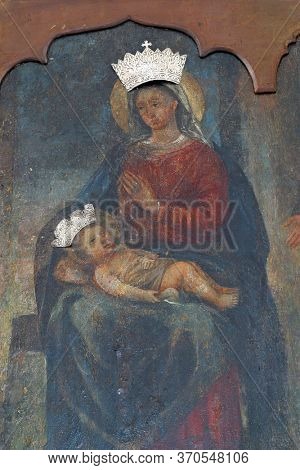 NOVALJA, CROATIA - SEPTEMBER 29, 2013: Virgin Mary with child Jesus, altarpiece at St. Mary's Church in Novalja, Croatia