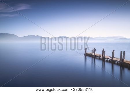 Wooden Pier Or Jetty And Lake At Sunrise. Torre Del Lago Puccini, Versilia, Massaciuccoli Lake, Tusc