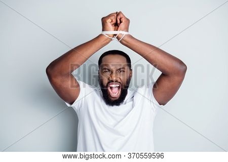 Photo Of Furious Dark Skin African Guy Citizen Antiracism Group Leader Showing Tied With Rope Arms F
