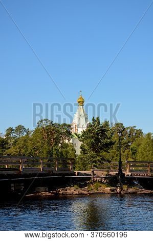Nikolsky Skit On Valaam Island As Seen From Ladoga Lake, Vertical Photo Of Beautiful Nature. Pilgrim