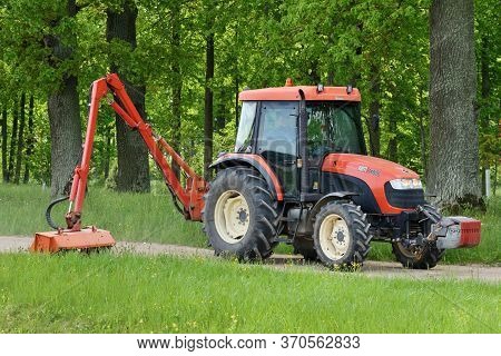 Bauska, June 01: Kioti Tractor Mow Grass In Large Park On June 01, 2020 At Bauska, Latvia. Kioti Tra