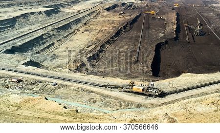 Panoramic View Of A Quarry With Huge Machine, Bucket Wheel Excavator Mining A Coal. Heavy Industry