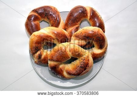Russian National Cuisine . Bagel With Poppy Seeds Isolated On White Plate Background . Bagels With P