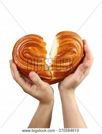 Hands Support A Rupture Heart Shaped Bun. The Concept Of A Broken Love Or A Sick Heart. Isolated On 