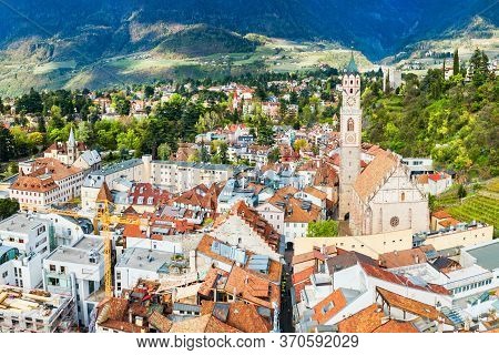 St. Nicholas Church Aerial Panoramic View In Merano. Merano Or Meran Is A Town In South Tyrol In Nor