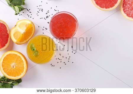 Tropical Orange And Grapefruit Juice With Basil Seeds Or Falooda Seeds Or Tukmaria In Glass On White