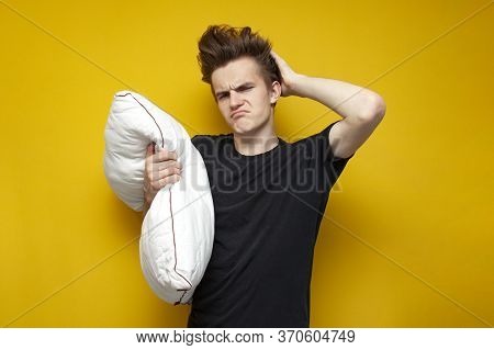 Tired Sleepy Guy With A Pillow Is Sad On A Yellow Background, Sleep Problem