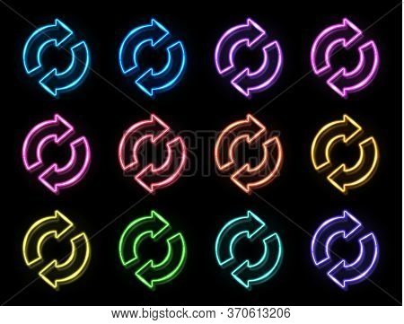 2 Arrow Circle Icon Set. 3d Color Neon Signs On Black Brick Background. Glowing Refresh Reload Rotat