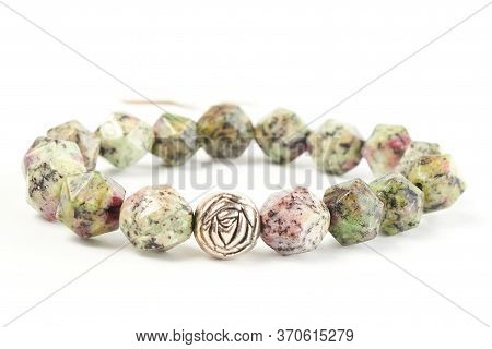 Bracelet Made Of Zoisite Beads On A White Background. Close Up