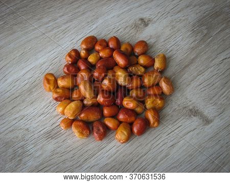 Dried Fruit Of Oleaster, Persian Olive, Russian Olive, Silver Berry, Oleaster, Or Wild Olive . Heap 