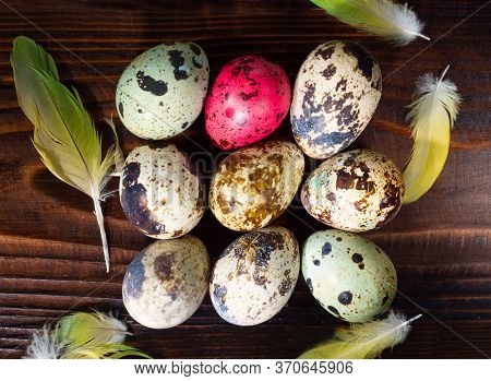 A Quail Eggs On A Wooden Background