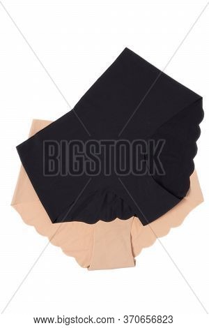 Underwear Woman Isolated. Close-up Of Beige And A Black Seamless Panties Isolated On A White Backgro