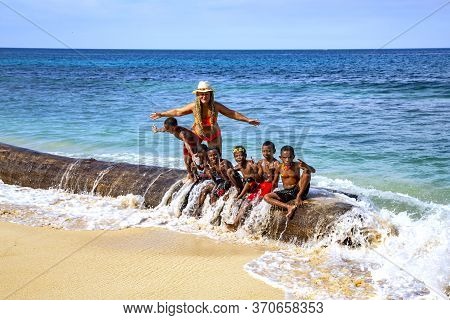 Papua New Guinea, Jayapura, August, 15, 2019 - Indonesian Funny Children Are Photographed With A Whi