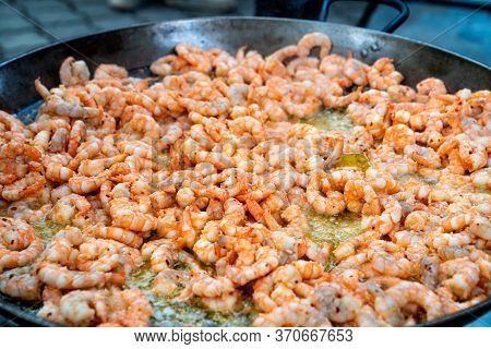 Seafood Street Food. King Prawns Fried Outdoors In A Large Frying Pan. Festival.