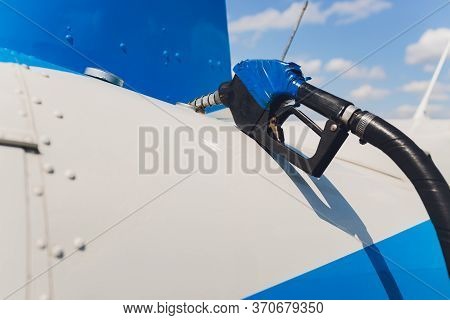 The Helicopter Is Refueling On The Helideck.