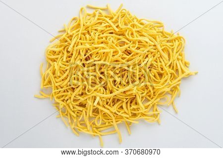 Dried Spätzle German Type Of Home Made Pasta In A Round Display Ready To Be Cooked, Isolated On Whit