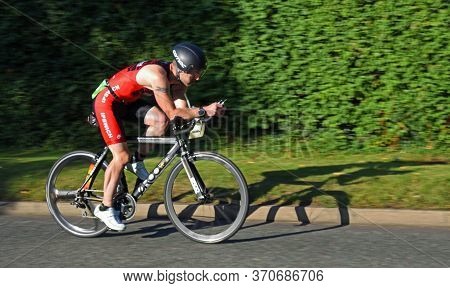 St Neots , Cambridgeshire, England - September 01, 2019: Male Triathlon Competitor On Cycling Stage 