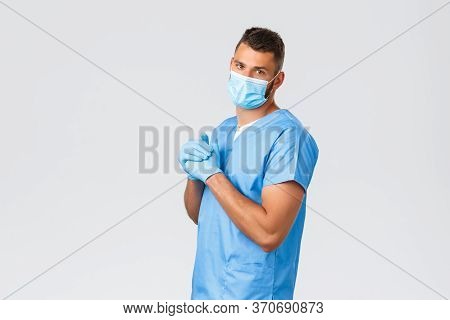 Healthcare Workers, Covid-19, Coronavirus And Preventing Virus Concept. Handsome Doctor, Male Nurse 