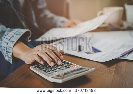Financial Household Debt Economy Accounting Concept. Close Up View Hands Of Person Calculating Month