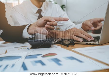 Financial Advisory Services. Asian Advisor Showing Plan Of Investment To Clients In The Consultancy 