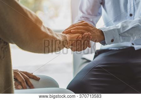 Counselor Touching Friend Shoulder And Encouraging To Help Relieve Her Sad