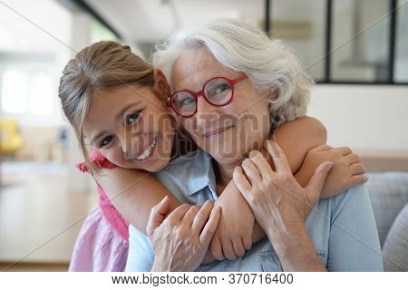Portrait of smiling grandmother with grandkid 