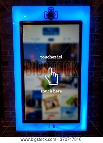 Montreal, Canada - October 23, 2019 - A Large Touchscreen Interactive Display At Travelodge Hotel