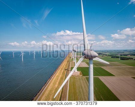 Windmill Park Westermeerdijk Netherlands, Wind Mill Turbine With Blue Sky In Ocean, Green Energy
