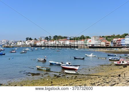 Mugardos, Spain. May 30, 2020. Fishing Village With Wooden Boardwalk, Colorful Houses And Boats With