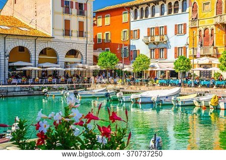 Desenzano Del Garda, Italy, September 11, 2019: Old Harbour Porto Vecchio With Boats On Turquoise Wa