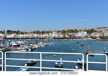 Mugardos, Spain. May 30, 2020. Fishing Village And Harbour With Colorful Houses And Boats With Blue 