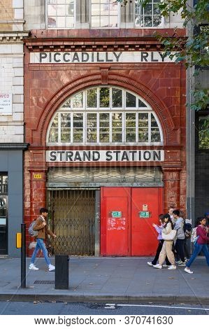 London - September 23, 2019: Students Passing In Front Of The Entrance To The Disused London Aldwych