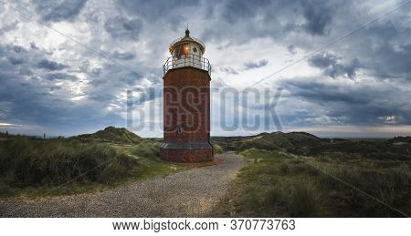 Red Brick Lighthouse, In The Evening, Under A Dark Sky, In Kampen, On Sylt Island Nature Reserve, Ge