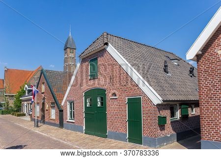 Street With Old Houses And Church Tower In Rijssen, Netherlands