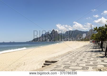 Deserted Ipanema And Leblon Beach With The Two Brothers Mountain In The Background During The Covid-