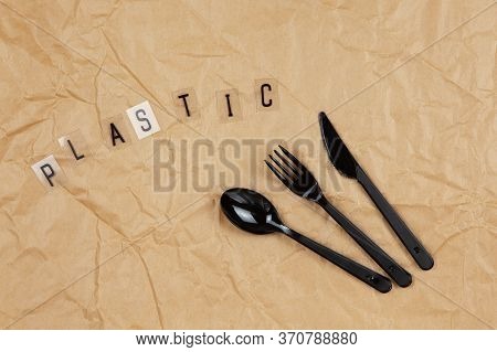 Disposable Black Appliances Fork, Spoon, Knife, Inscription Plastic From Letters On Transparent Base