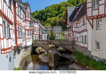 River Elz With Old Bridge And Half-timbered Houses In Monreal, Germany