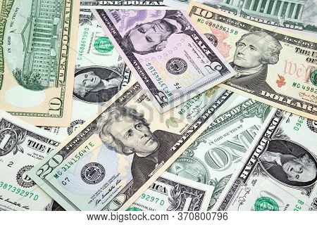 Mix Of American Dollars Bills In Denominations Of 1, 5, 10 And 20 Close Up.