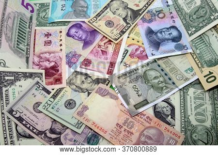 Mix Of American, Chinese And Indian Colorful Banknotes.