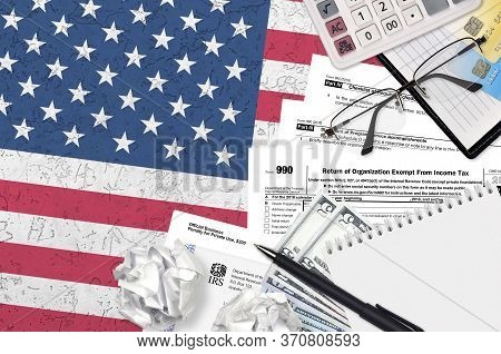 Irs Form 990 Return Of Organization Exempt From Income Tax Lies On Flat Lay Office Table And Ready T