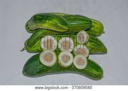 Green & Yellow Cocumbers With Cut Pieces Image. Indian Summer Season Vegitable 1