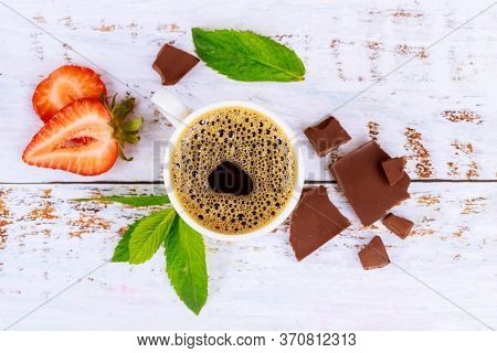 Espresso Coffee With Foam, Mint And Chocolete Pieces. Top View.
